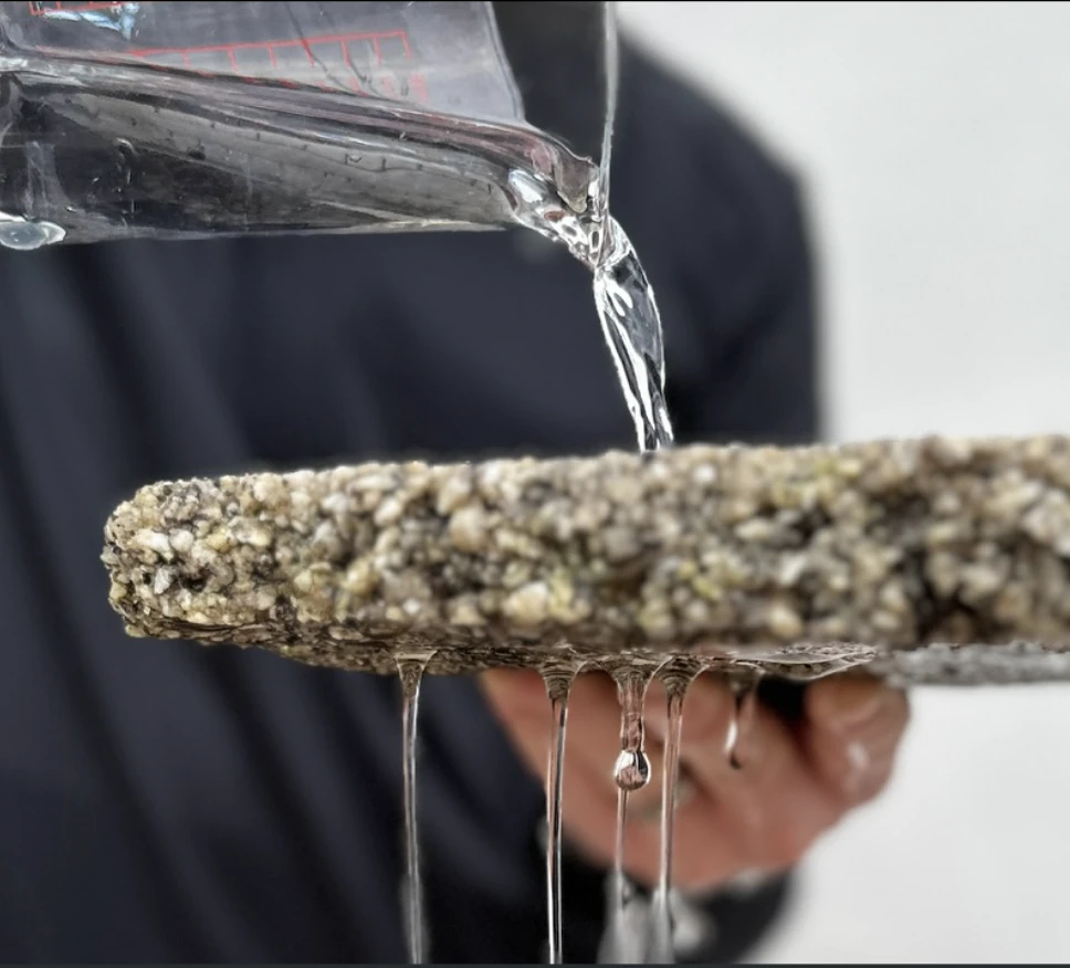 Water draining straight through a permeable resin bound driveway surface