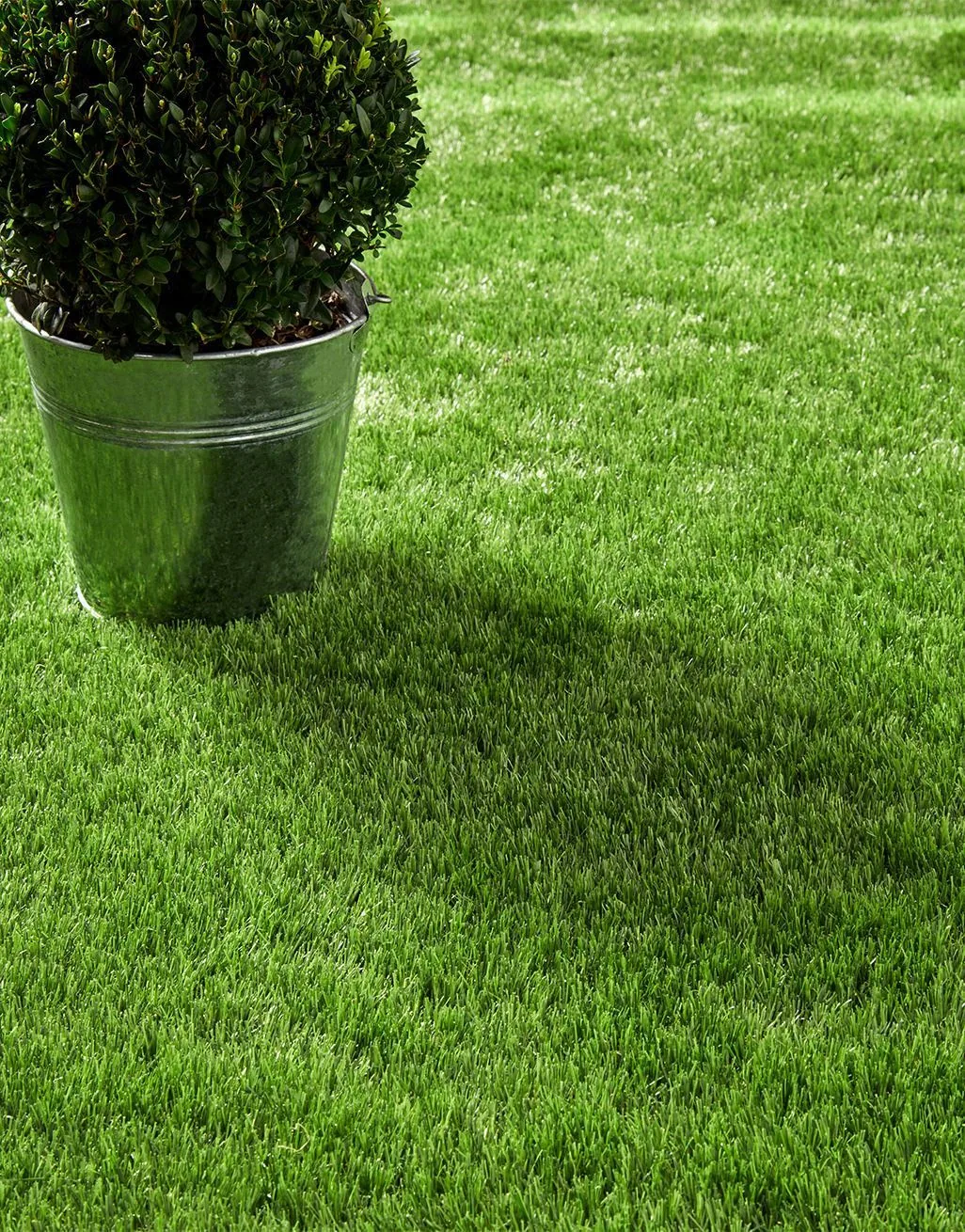 Close-up of realistic artificial grass with neat edging